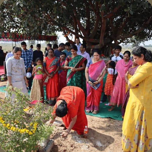 Co-farmer families gathered for a planting ceremony