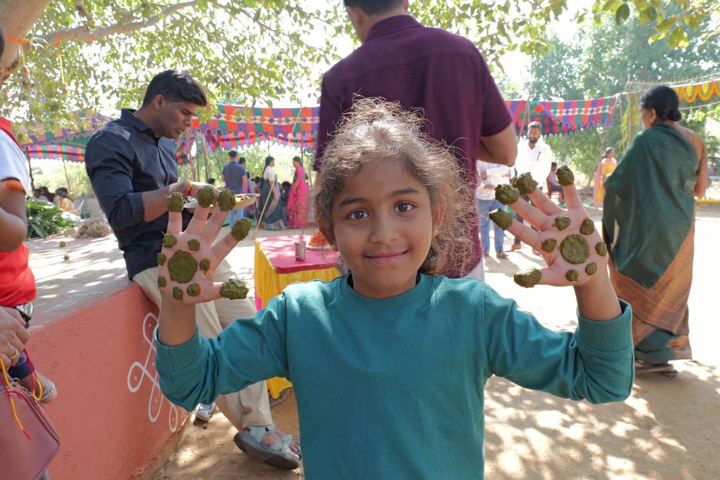 A smiling child at a farm festival