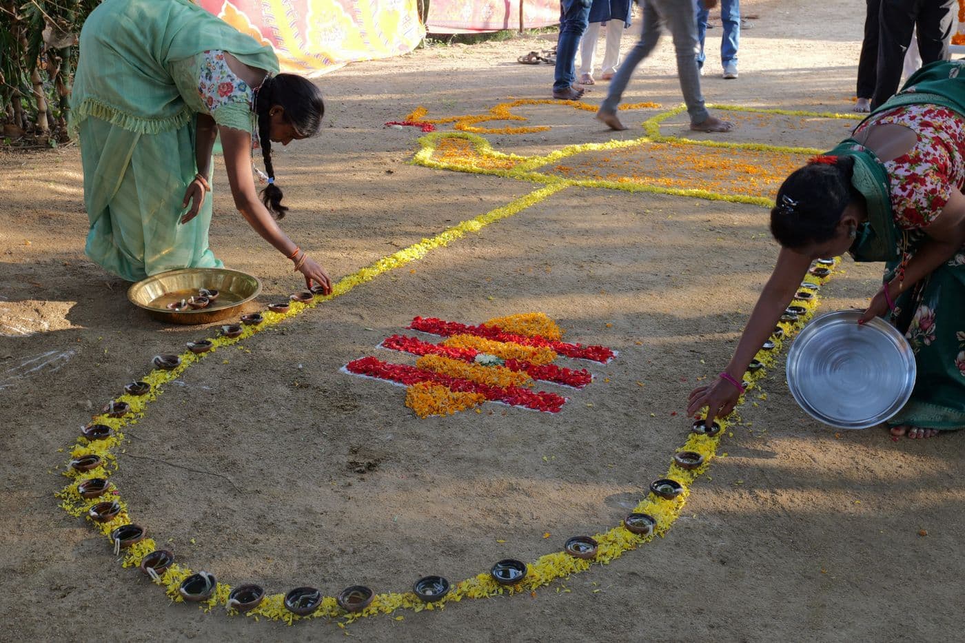 A flower rangoli on the ground