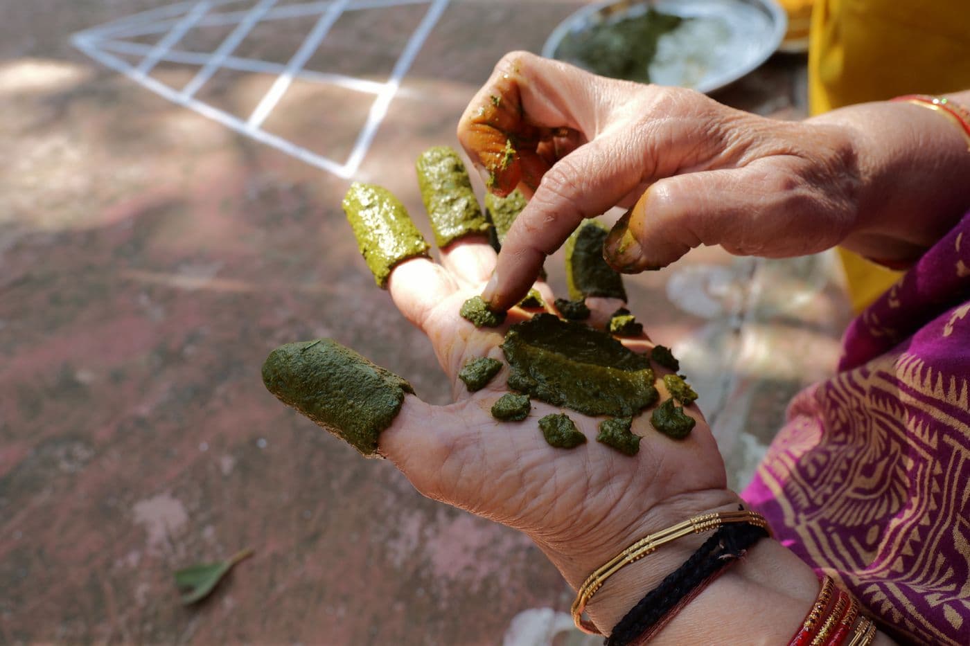 Hands decorated with fresh henna at a festival