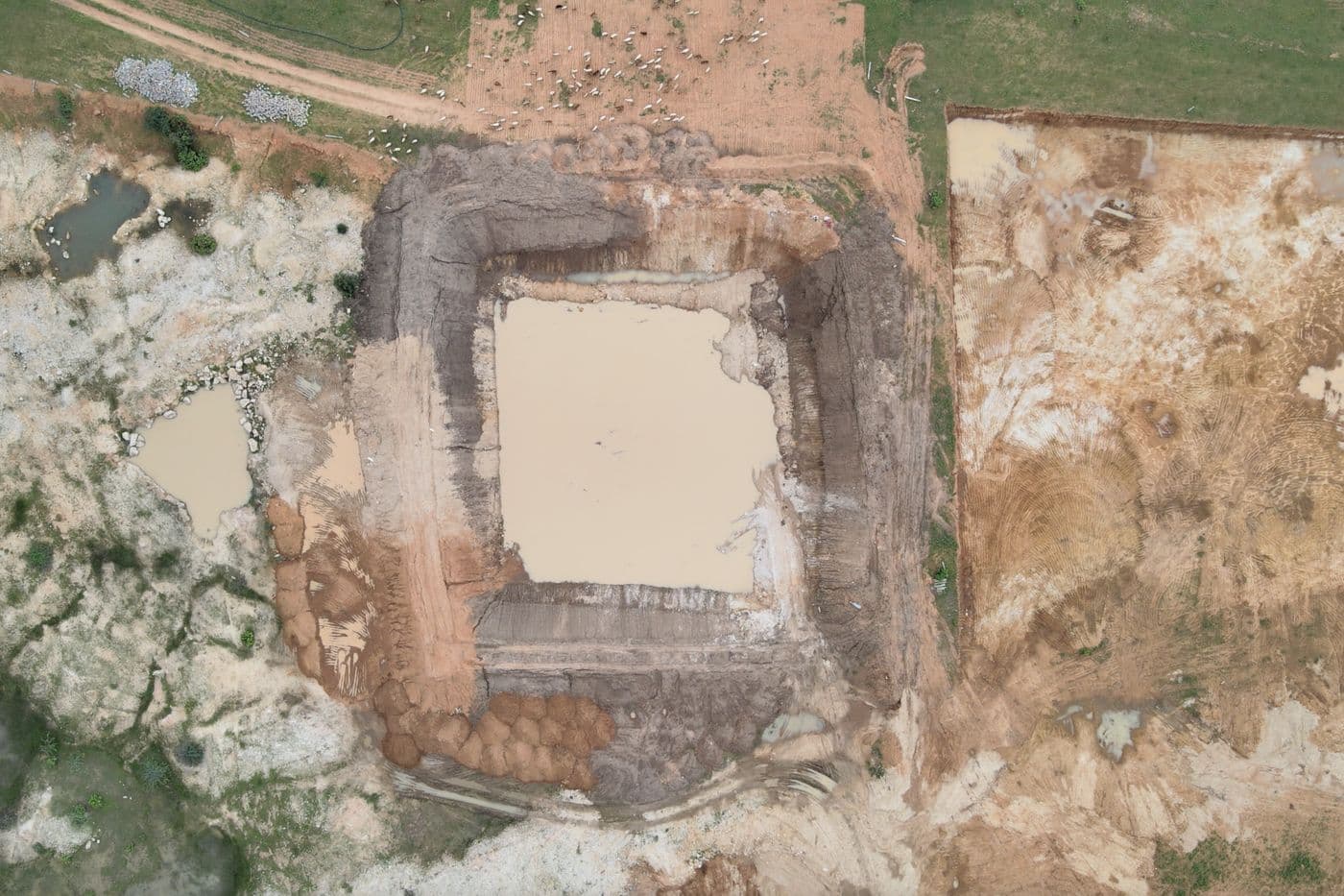 A farm pond being dug for water harvesting