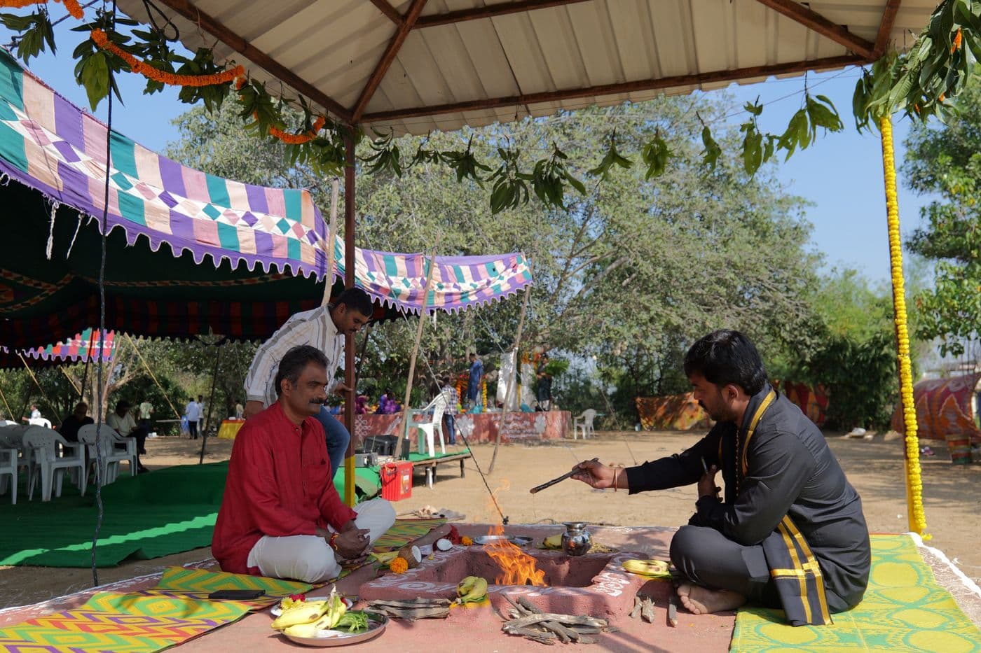 A havan ceremony under a festive canopy